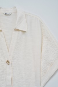 BLUSE MIT SCHLEIFE AM SAUM