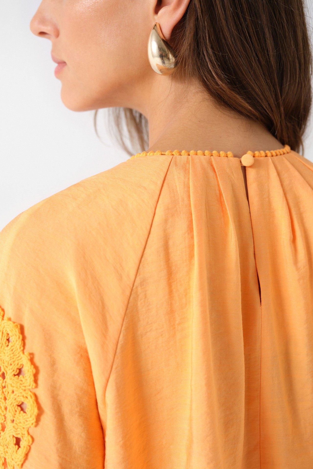 SMOCK TOP WITH EMBROIDERED DETAILS
