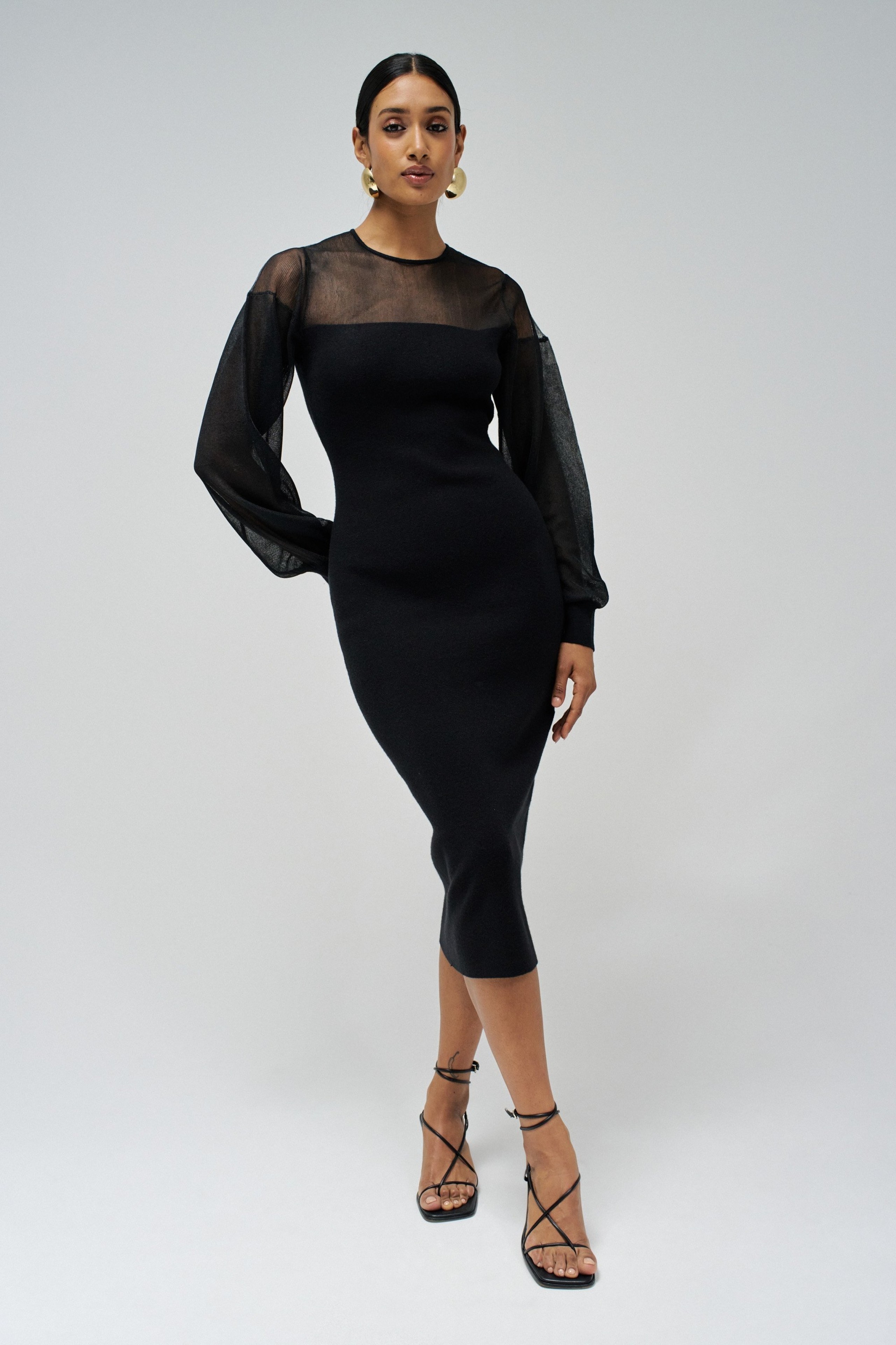 VESTIDO JUSTO DE MALHA COM TRANSPARÊNCIAS