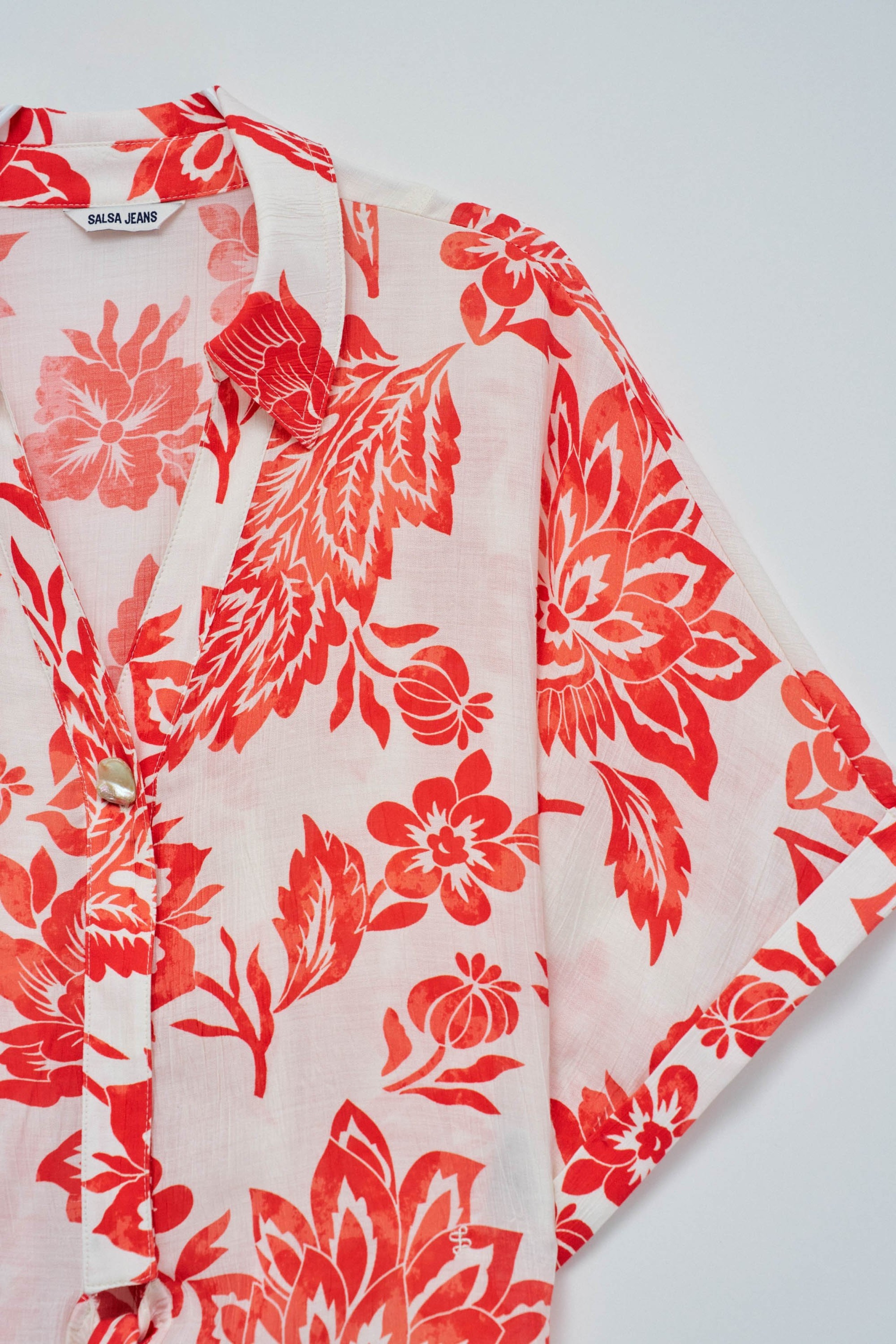 CAMISA CON LAZO EN EL DOBLADILLO