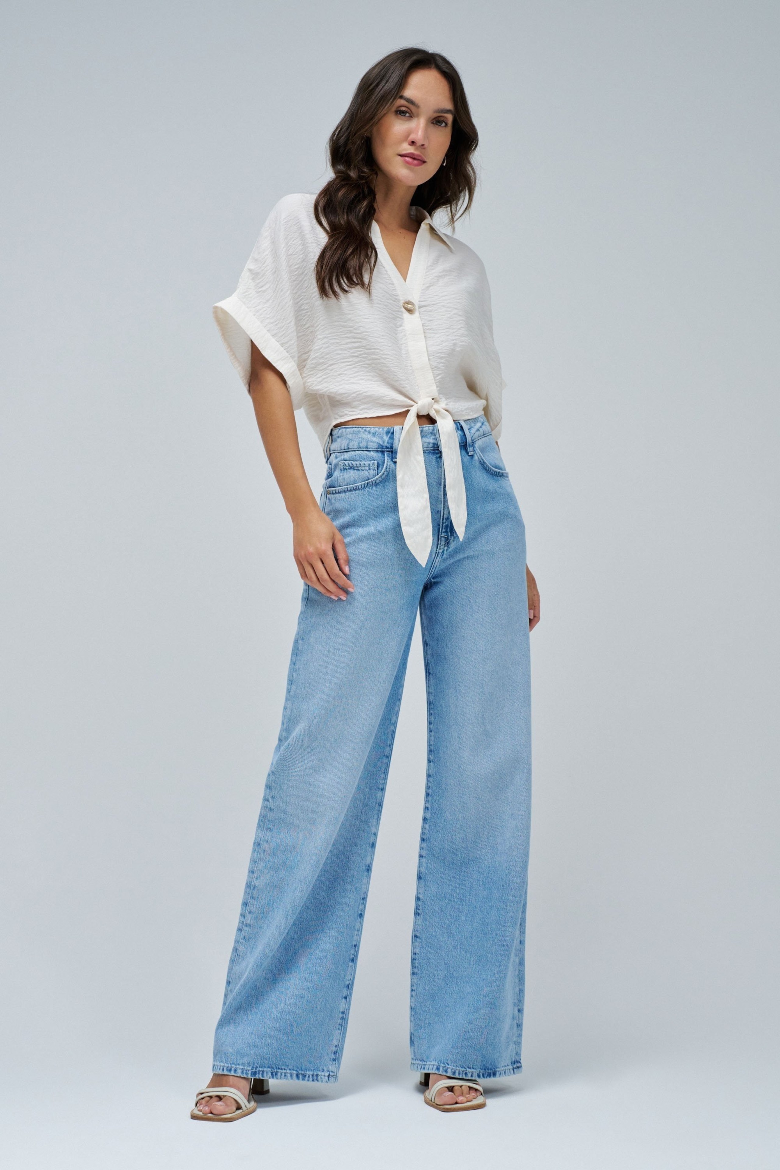 SHIRT WITH BOW AT THE HEM