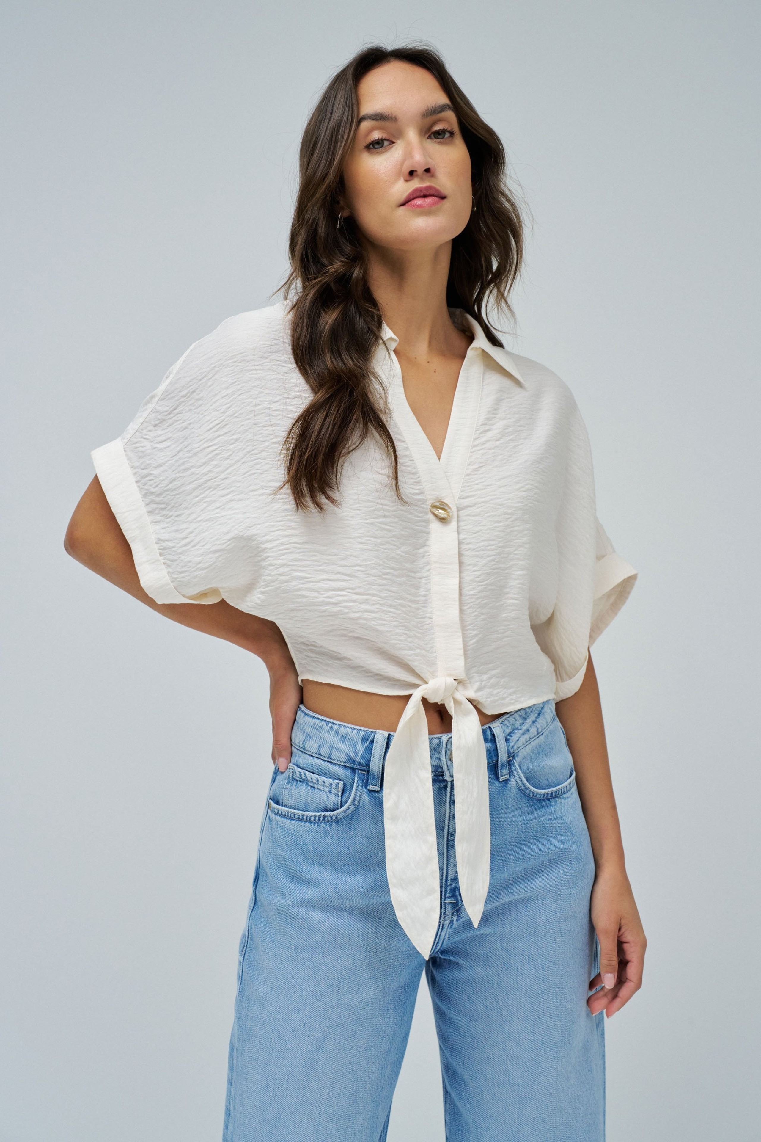 SHIRT WITH BOW AT THE HEM