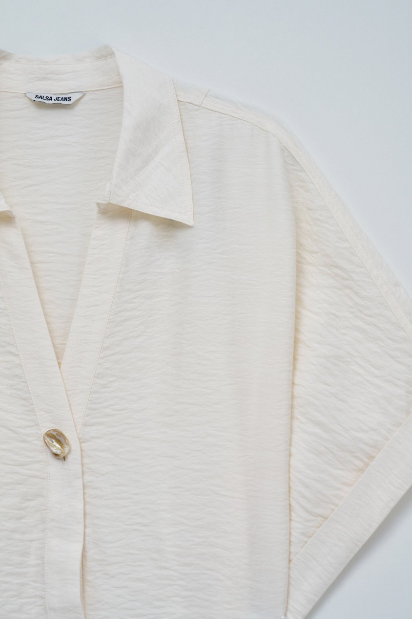 SHIRT WITH BOW AT THE HEM