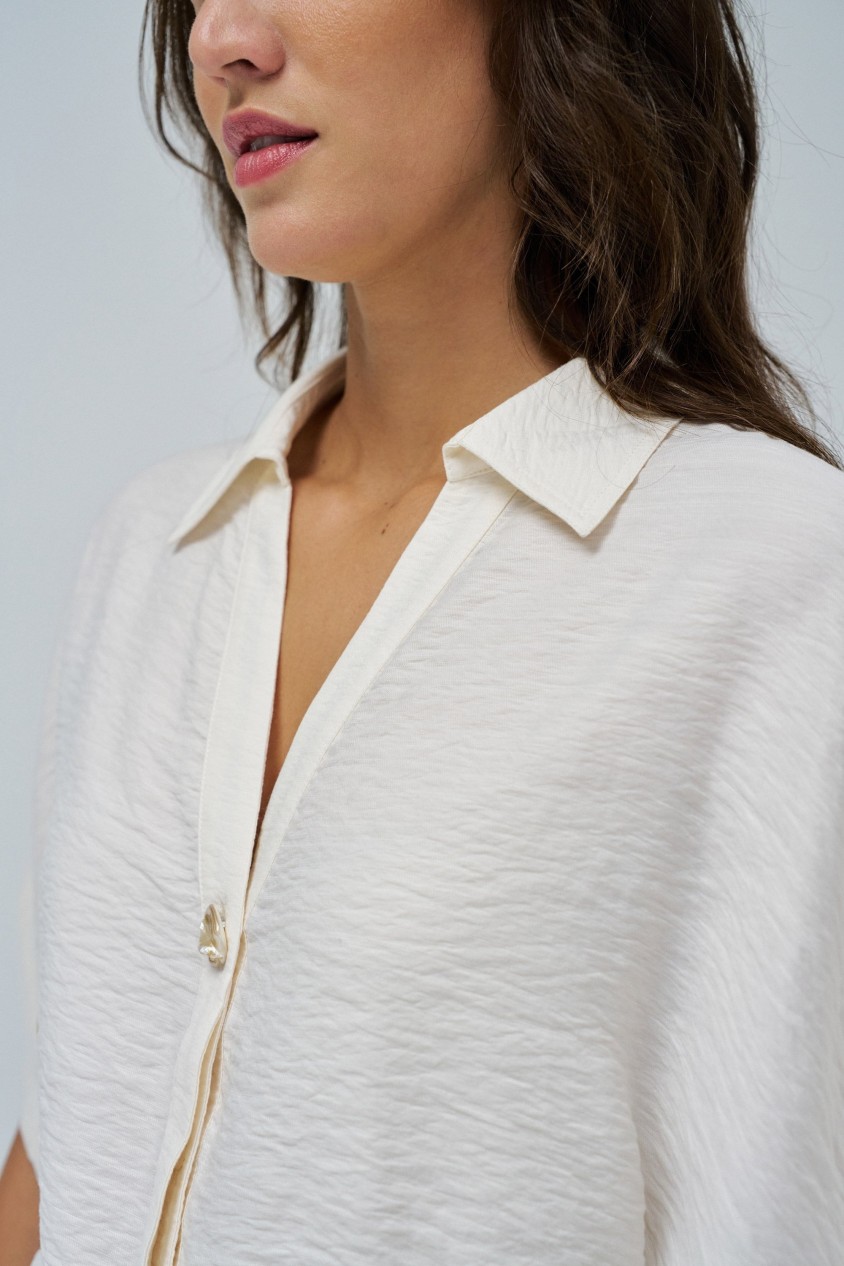 SHIRT WITH BOW AT THE HEM