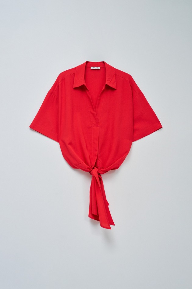BLUSE IN HELLBLAU MIT SCHLEIFE AM SAUM