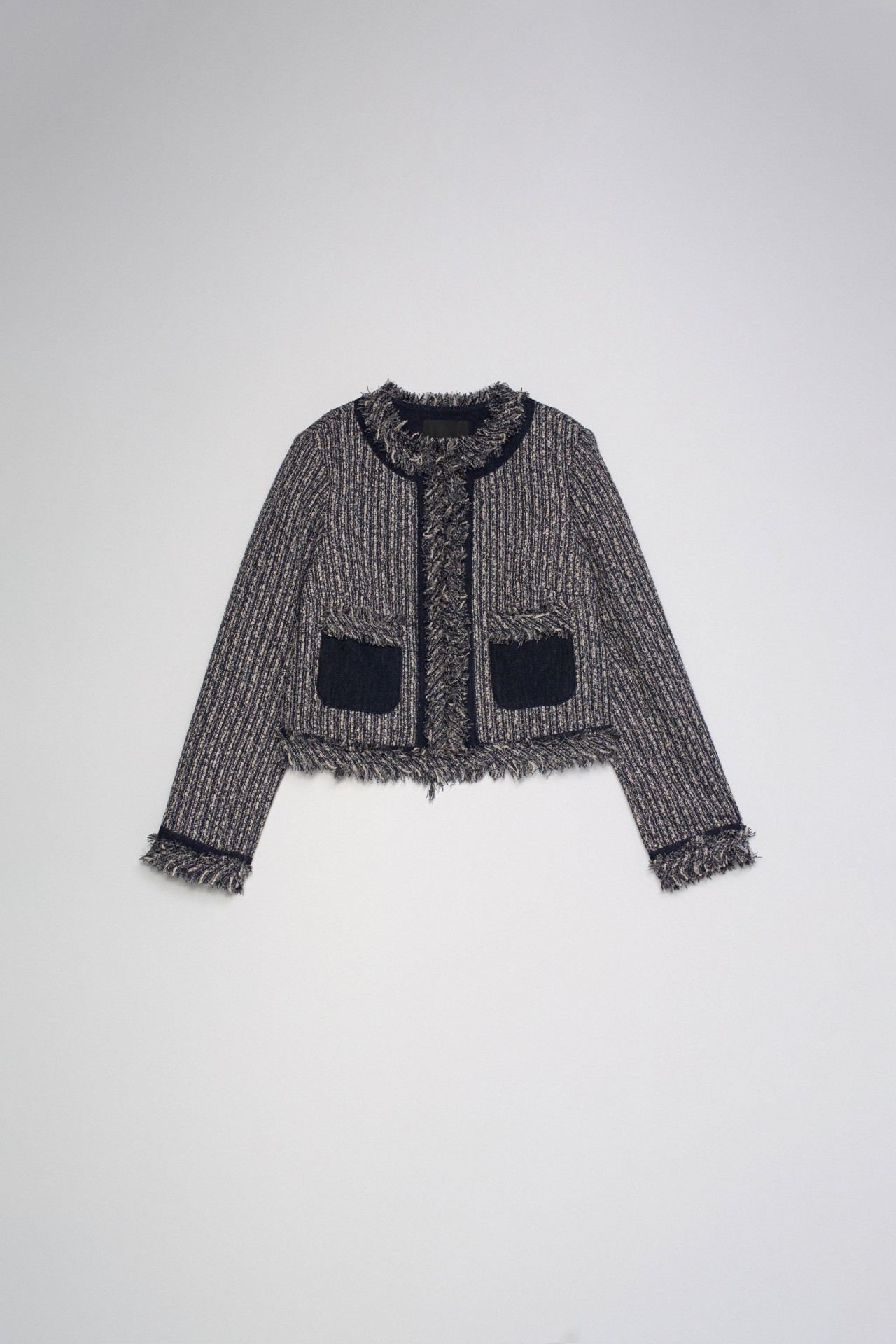 CHAQUETA DE TWEED CON FLECOS