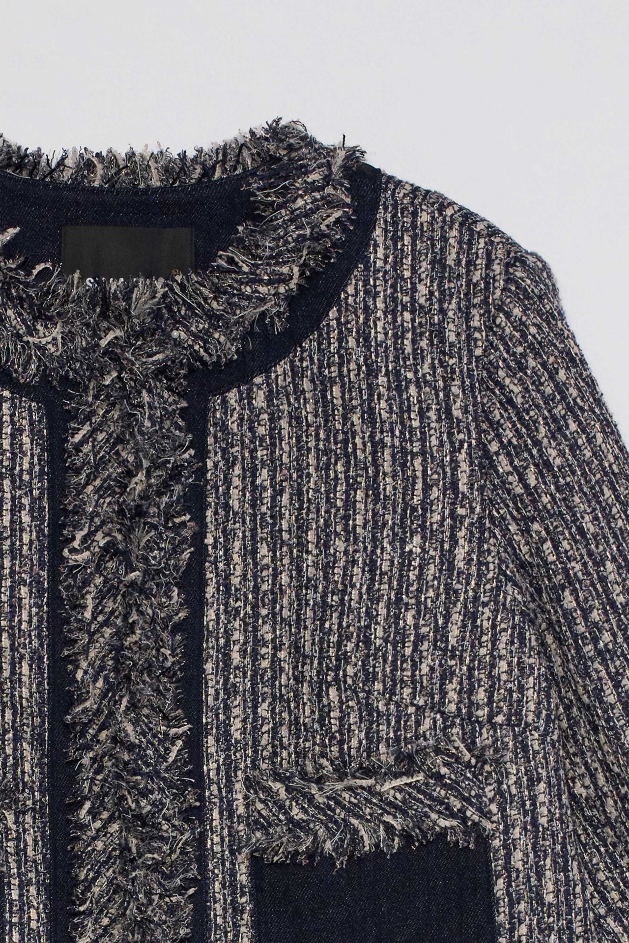 CHAQUETA DE TWEED CON FLECOS