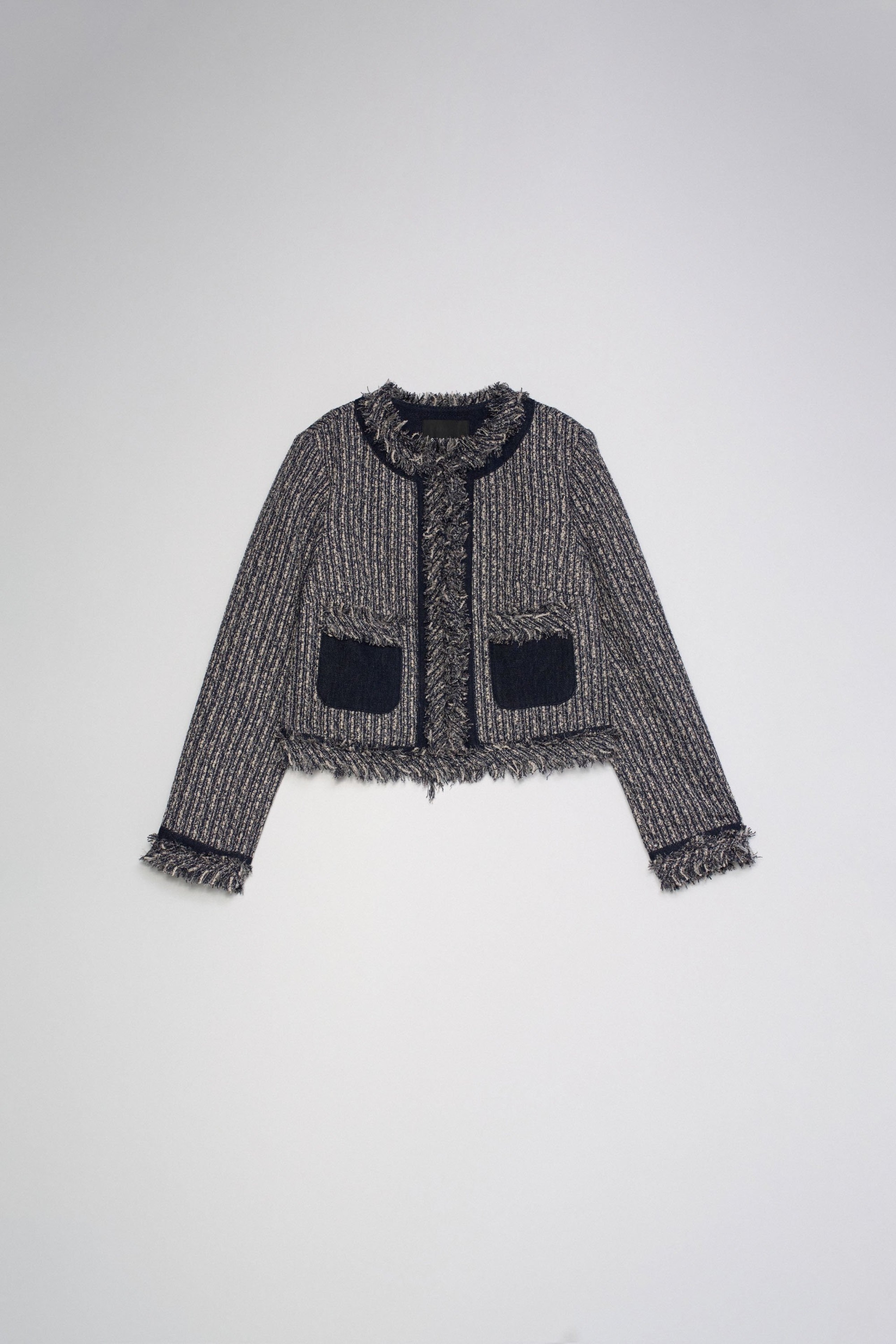 CHAQUETA DE TWEED CON FLECOS