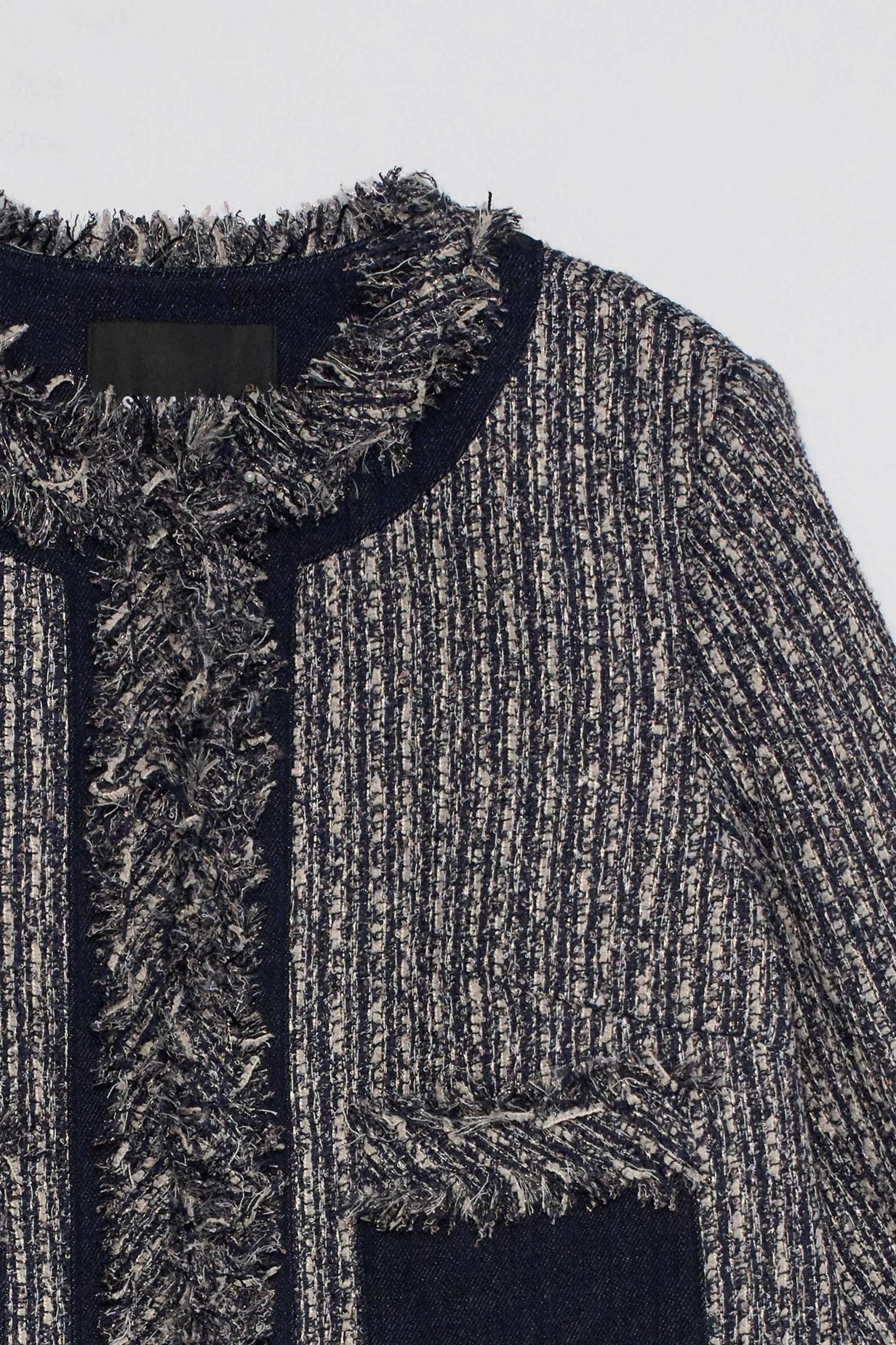 CHAQUETA DE TWEED CON FLECOS